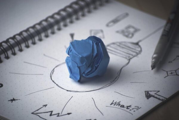 Drawing of a lightbulb with a piece of blue tac at the centre